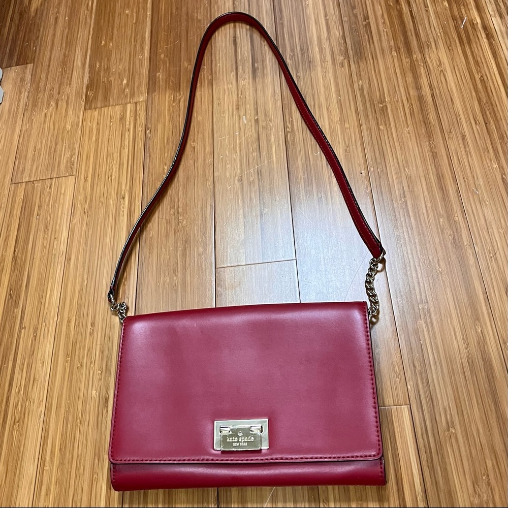 Red Kate Spade cross body/long strap bag